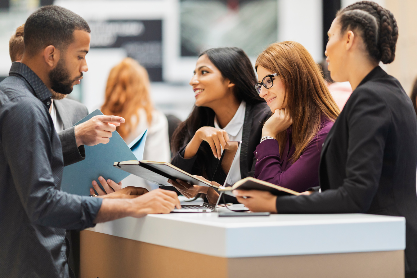 Business people attending an exhibition