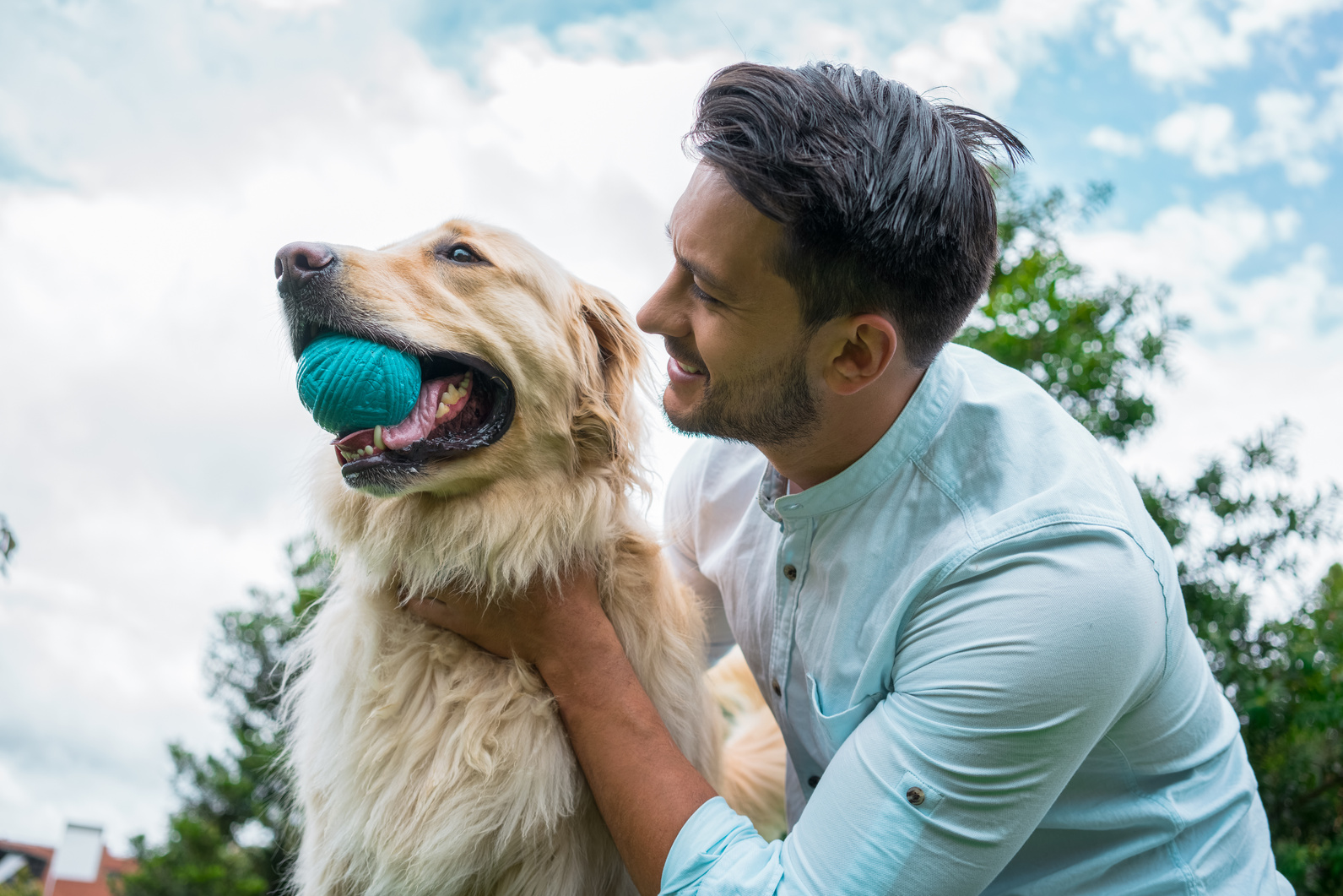 Man playing with his pet